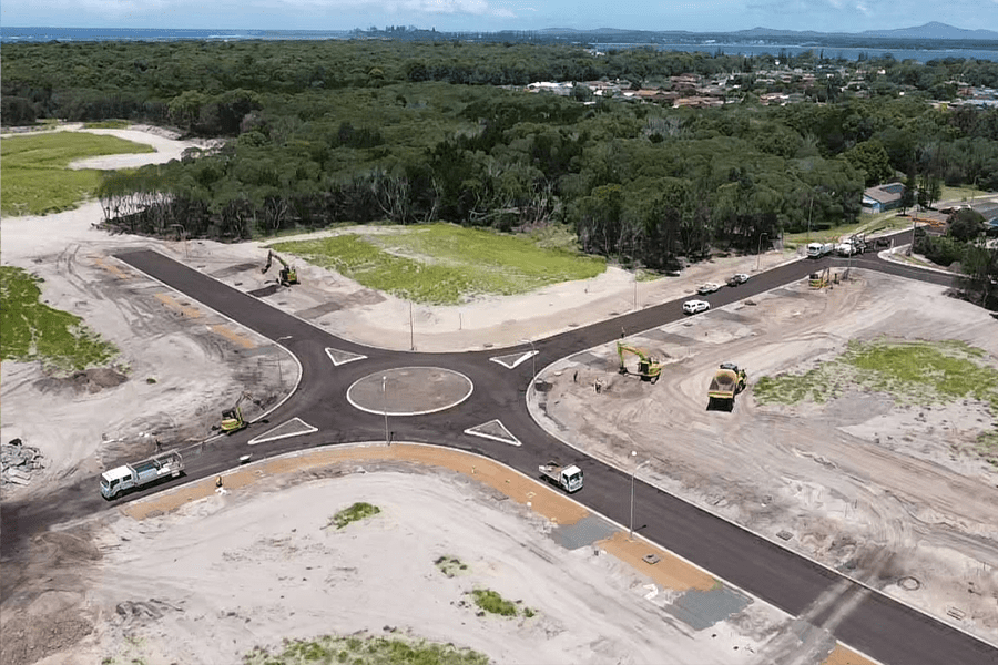 31/01/22 : Stage 1 looking south east over Laurie Drive roundabout – roads with preseal and aggregate wearing surface prior to asphaltic concrete finish